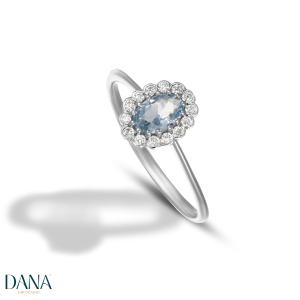 Anello pietra azzurra con contorno di zirconi in oro bianco 9 kt - gallery