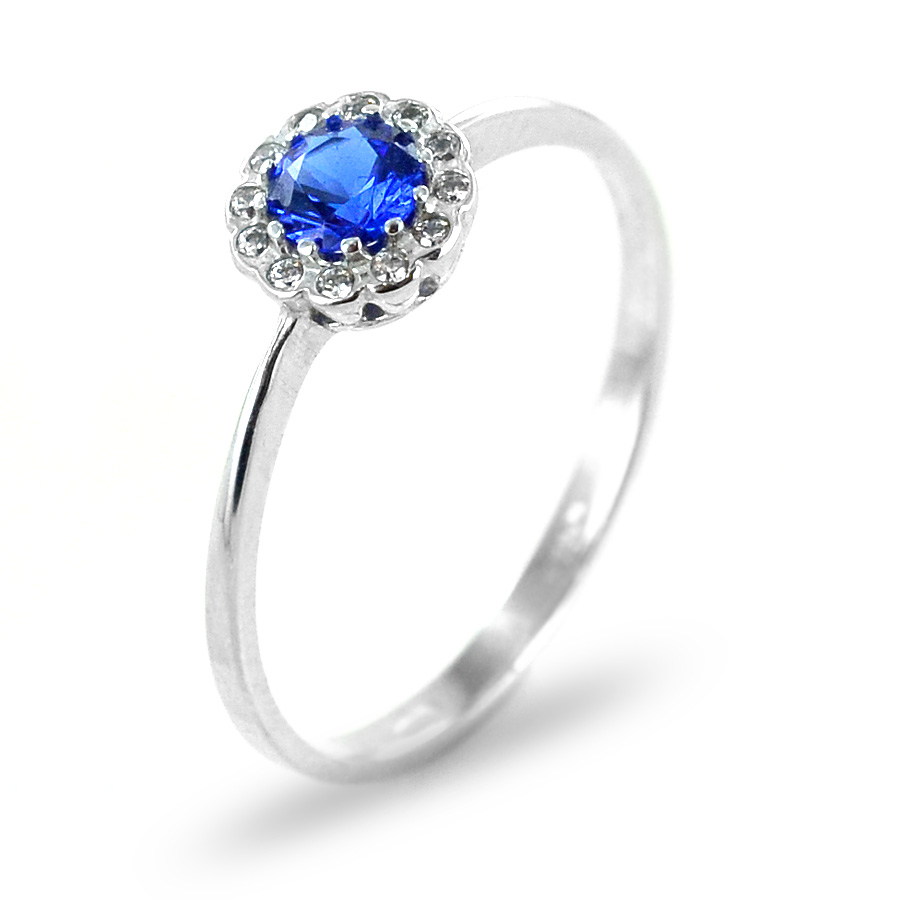 Anello con zircone blu e contorno di zirconi bianchi