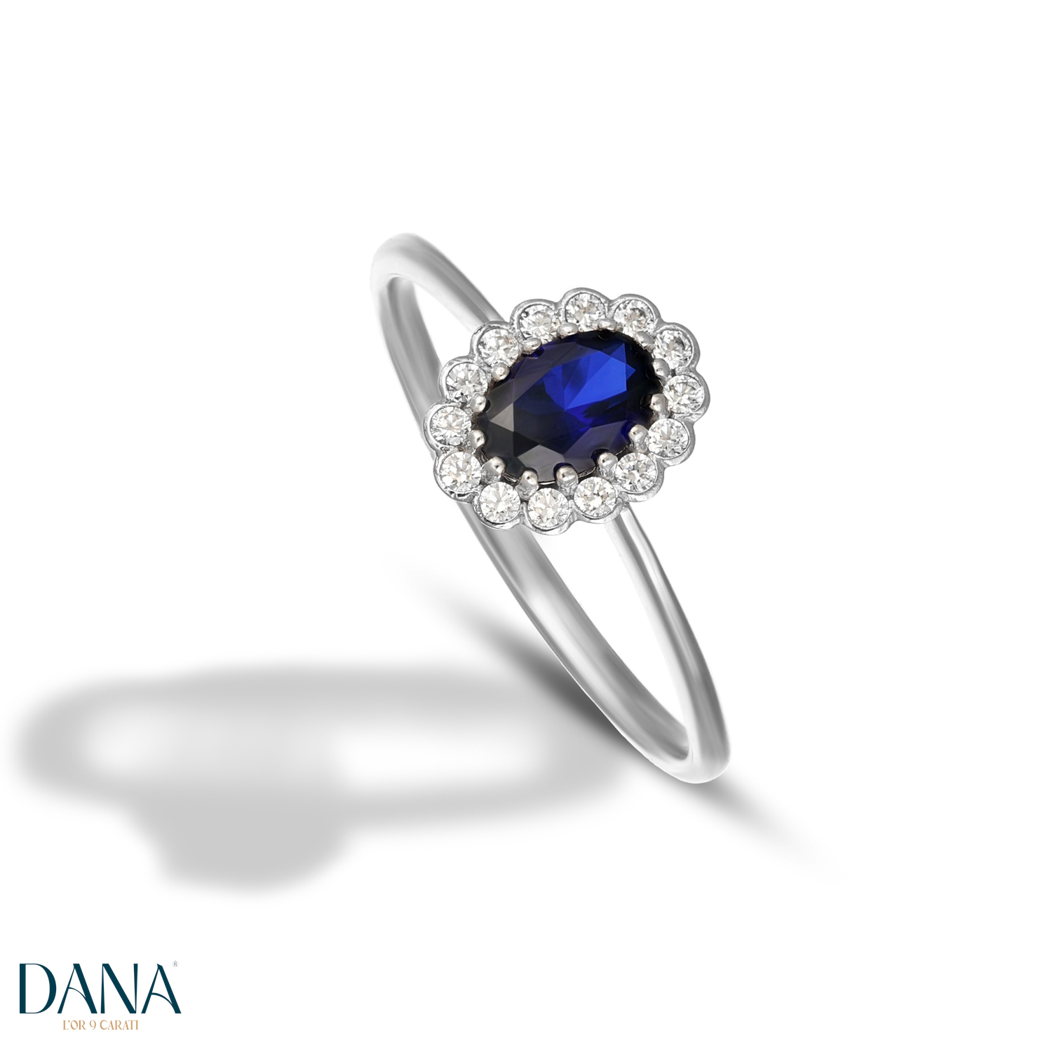 Anello pietra blu con contorno di zirconi in oro bianco 9 kt