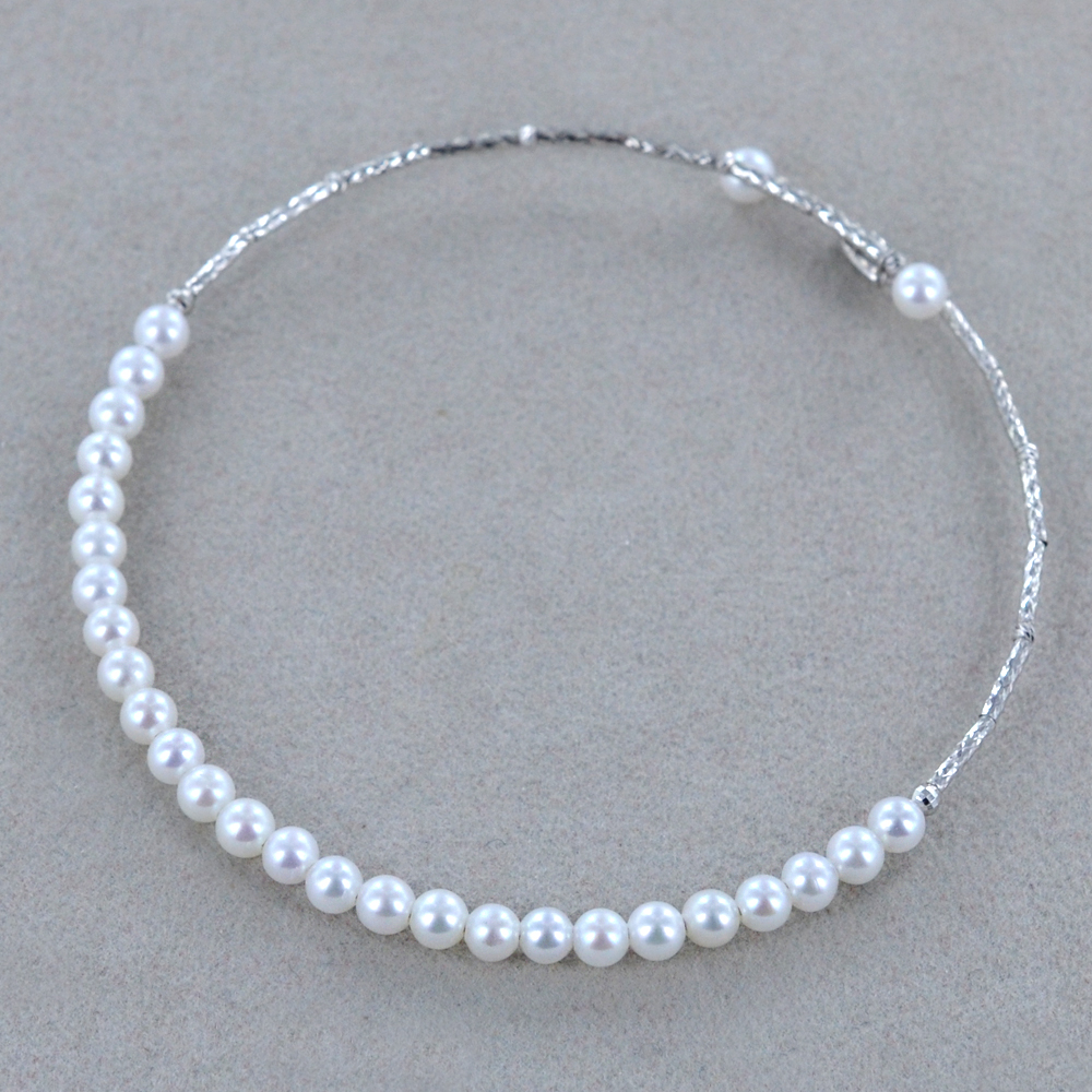 Bracciale in oro 14kt (585/1000) con diamanti e perle in Oro